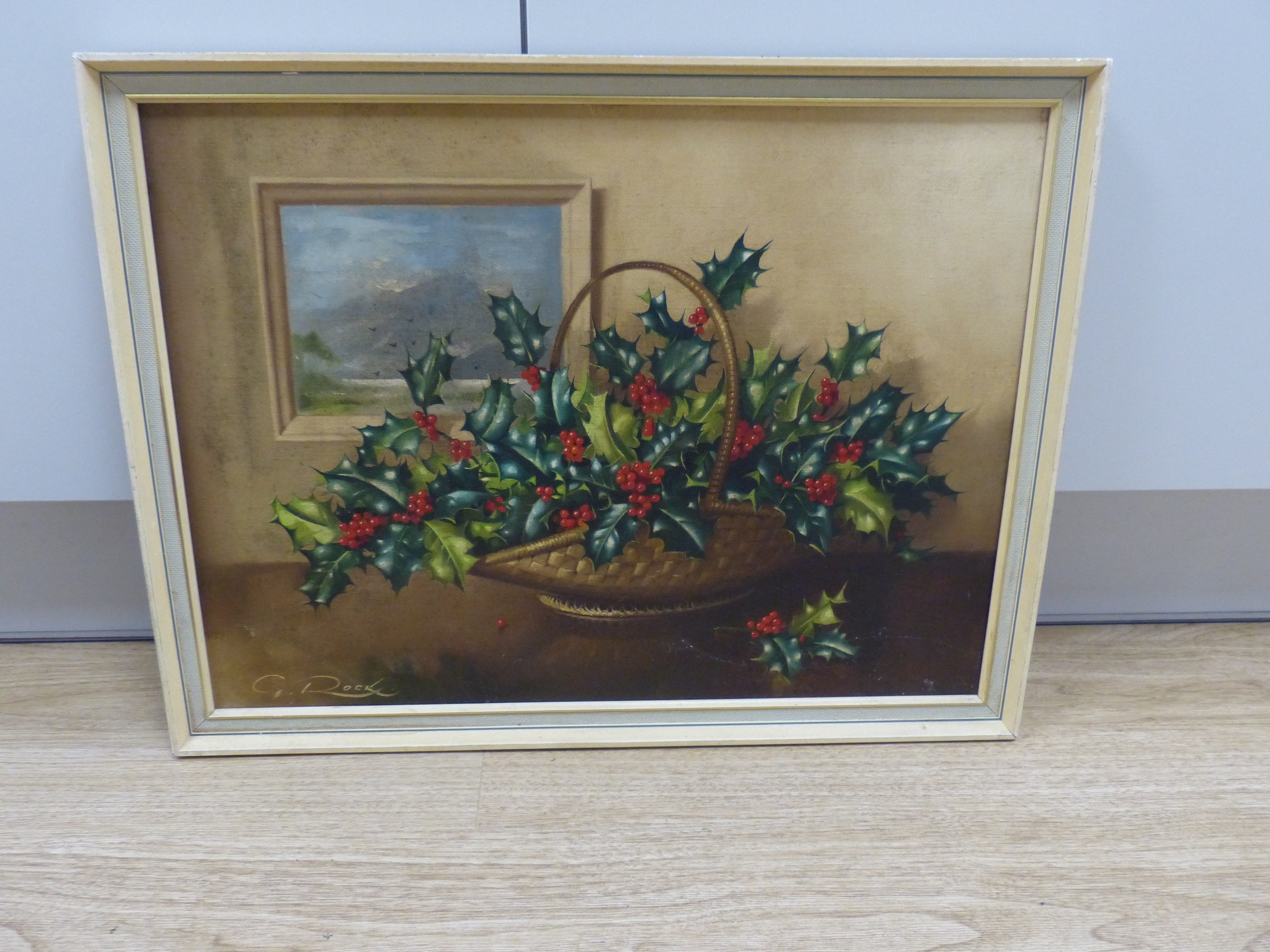 Geoffrey A Rock (Canadian 1923-2000), oil on canvas, Still life of holly in a basket, signed, 37 x 50cm